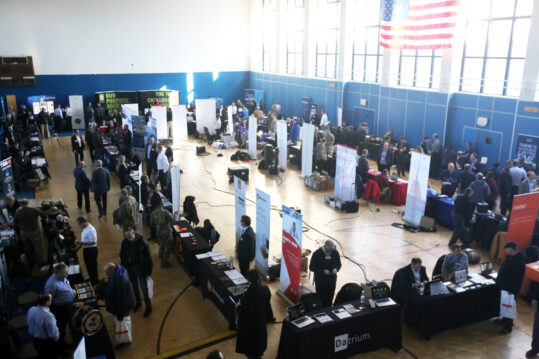 A view of exhibitors and atendees at the U.S. Army Garrison Wiesbaden Tech Expo, Feb. 13, 2018 in the Tony Bass Gym on Clay Kaserne in Wiesbaden, Germany. (U.S. Army photo by William B. King)